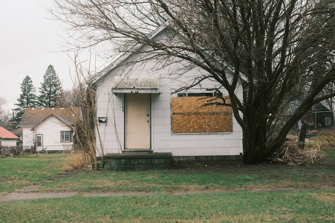 Illustrative boarded residential property, representing temporary board-up protection after property damage